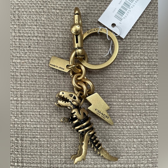 Coach Small Rexy Skeleton Bag Charm in colour brass - Picture 2 of 13